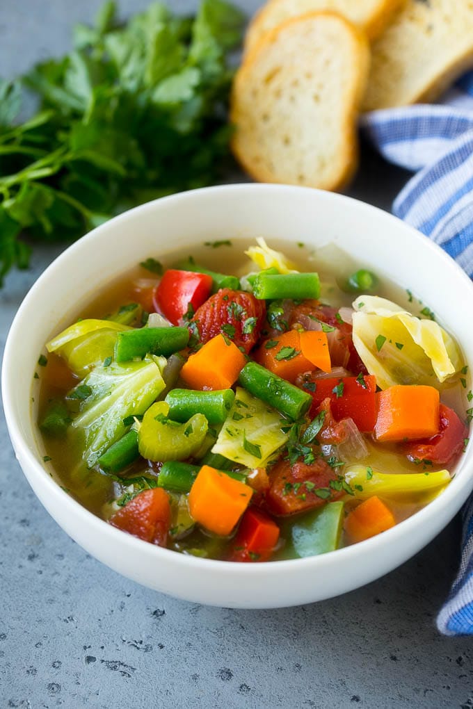 Cabbage Soup Recipe | Vegetable Soup | Veggie Soup | Healthy Soup #soup #healthy #cleaneating #cabbage #vegetables #veggies #dinner #edsug A bowl of cabbage soup with carrots, celery and tomatoes in broth.