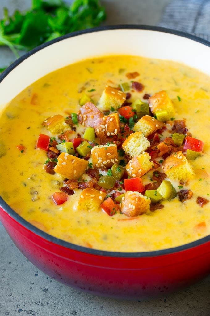 Cheeseburger Soup Recipe | Hamburger Soup | Cheese Soup #soup #groundbeef #hamburger #cheese #bacon #dinner #edsug Cheeseburger soup topped with bacon, tomato, pickles and croutons.