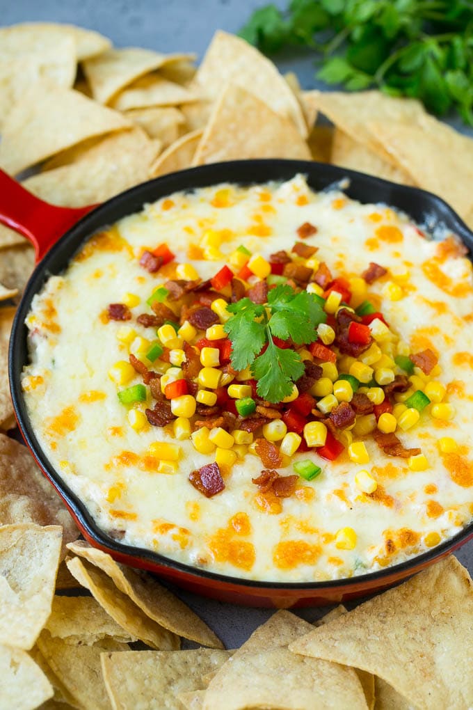 Corn Dip Recipe | Hot Cheese Dip | Bacon Dip #corn #dip #bacon #cheese #appetizer #snack #edsug Hot corn dip made with two types of cheese, corn, peppers and bacon, served with tortilla chips.