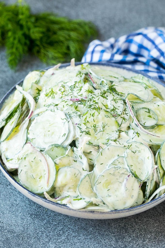Creamy Cucumber Salad Recipe | German Cucumber Salad | Cucumber Salad #cucumber #salad #dinner #lunch #edsug #cucumbersalad A serving bowl of creamy cucumber salad topped with fresh dill.