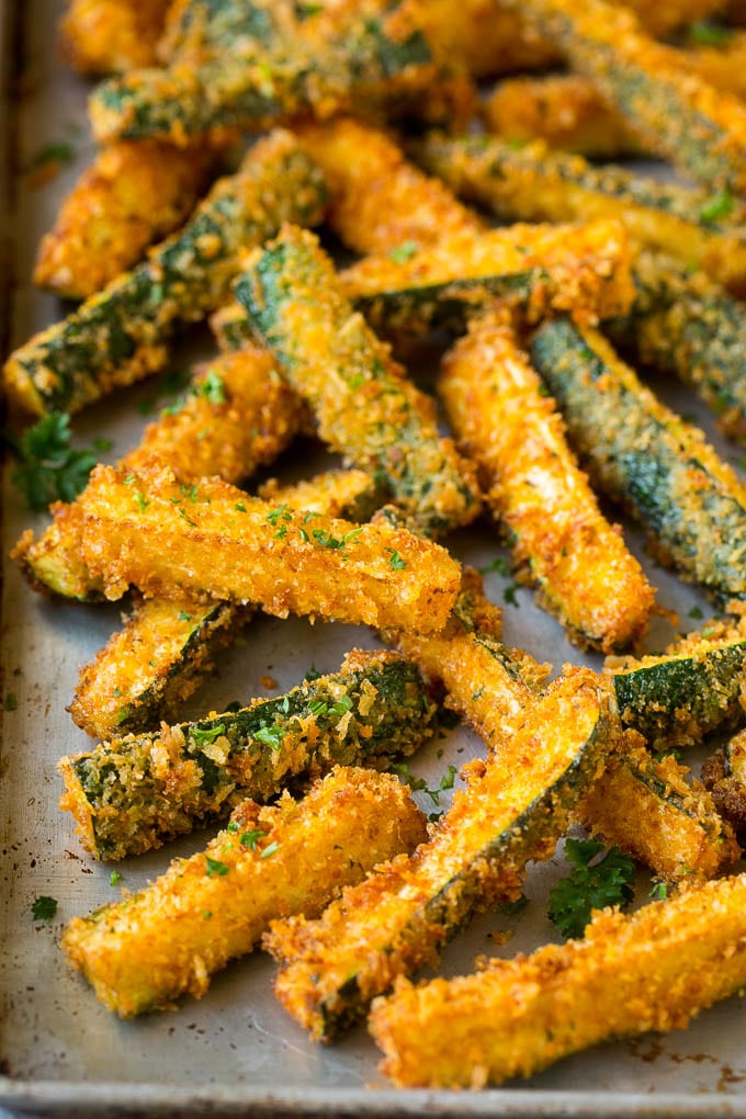 Fried Zucchini Recipe | Zucchini Fries | Zucchini Recipe #appetizer #zucchini #snack #edsug Fried zucchini sticks on a sheet pan.