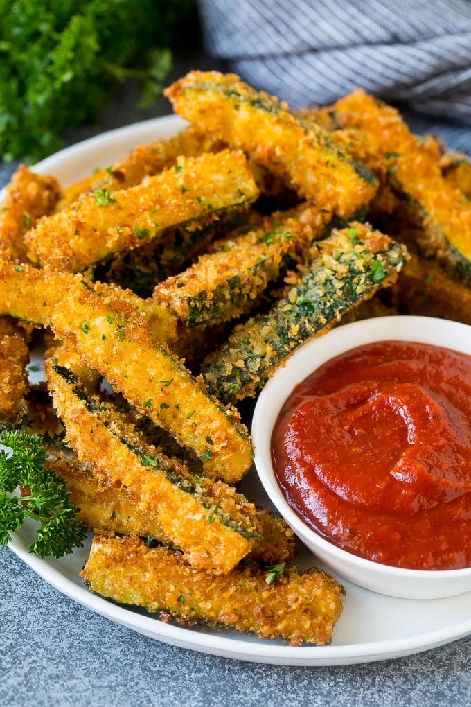 Fried Zucchini Recipe | Zucchini Fries | Zucchini Recipe #appetizer #zucchini #snack #edsug A plate of fried zucchini served with marinara for dipping.