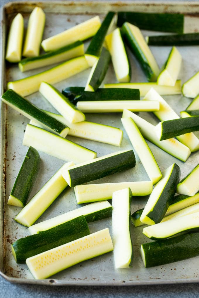 Fried Zucchini Recipe | Zucchini Fries | Zucchini Recipe #appetizer #zucchini #snack #edsug Raw sticks on a sheet pan.