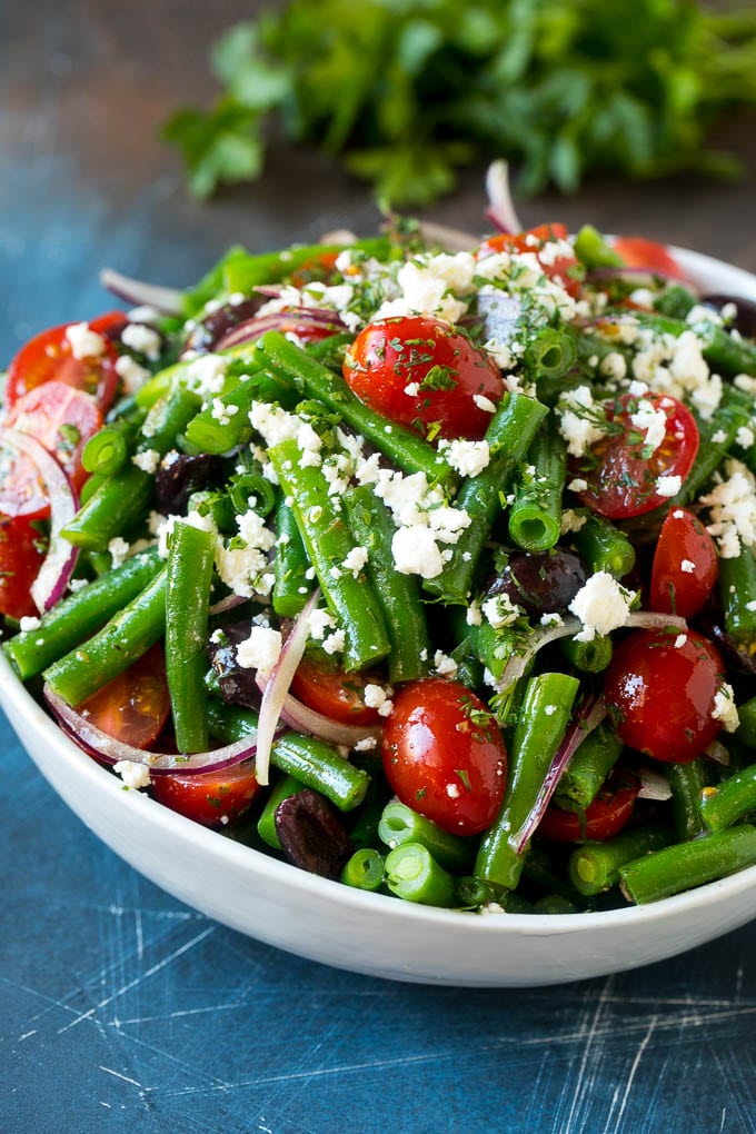 Green Bean Salad Recipe | String Bean Salad | Chopped Salad #greenbeans #tomatoes #olives #salad #cleaneating #lowcarb #glutenfree #edsug Green bean salad tossed in a vinaigrette and topped with feta cheese and herbs.