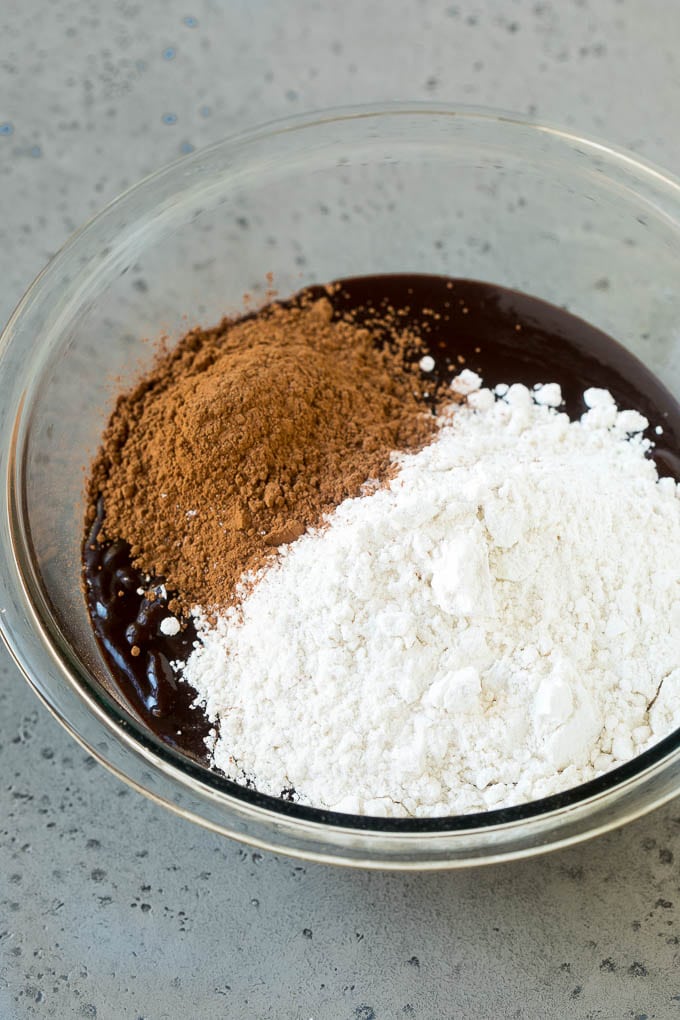Oreo Brownies Recipe | Homemade Brownies | Chocolate Chip Brownies #brownies #oreos #chocolate #dessert #sweets #edsug Melted chocolate, sugar, cocoa powder and flour in a mixing bowl.