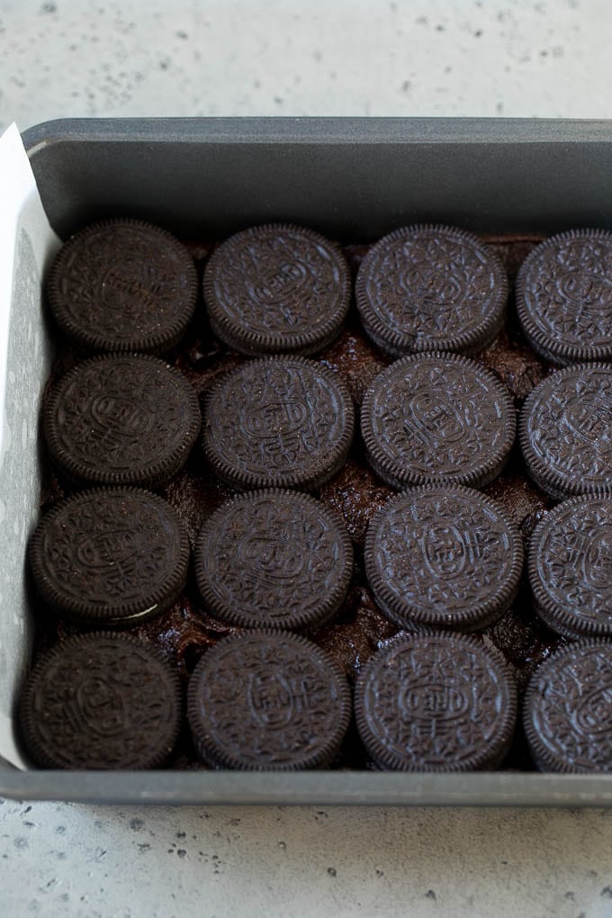 Oreo Brownies Recipe | Homemade Brownies | Chocolate Chip Brownies #brownies #oreos #chocolate #dessert #sweets #edsug A layer of brownie batter with a layer of Oreo cookies on top.