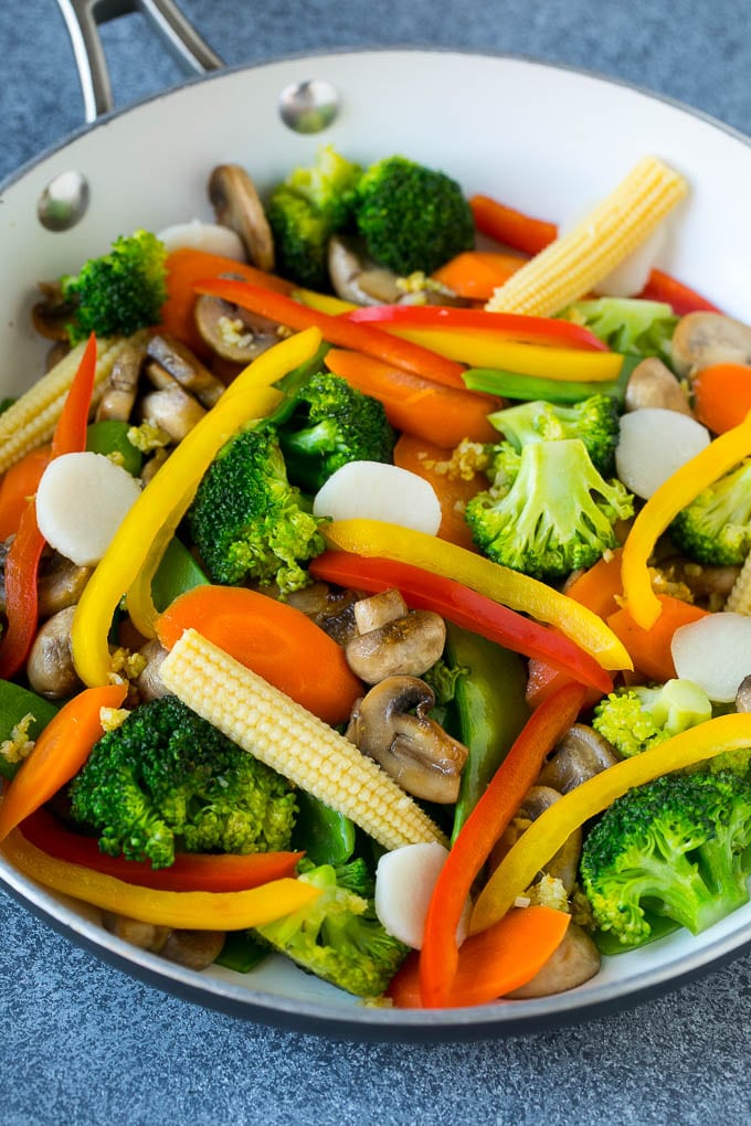 Vegetable Stir Fry Recipe | Veggie Stir Fry | Broccoli Stir Fry #vegetarian #vegetables #broccoli #dinner #edsug A pan of sauteed baby corn, water chestnuts, peppers, broccoli and mushrooms.