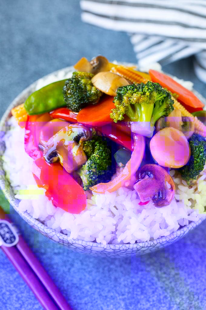 Vegetable Stir Fry Recipe | Veggie Stir Fry | Broccoli Stir Fry #vegetarian #vegetables #broccoli #dinner #edsug Vegetable stir fry served over rice in a bowl.