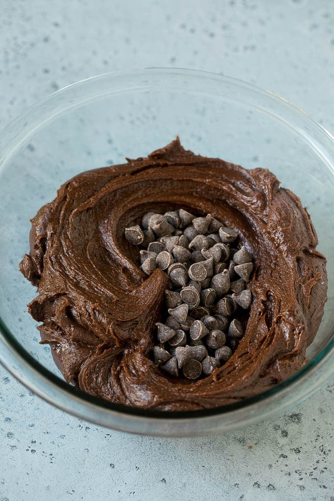Cheesecake Brownies Recipe | Cream Cheese Brownies | Homemade Brownies #brownies #cheesecake #chocolate #dessert #edsug Brownie batter and chocolate chips in a mixing bowl.