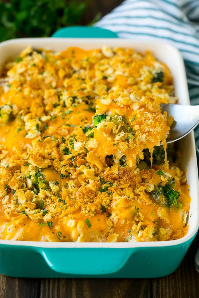Chicken Casserole Recipe | Chicken and Rice Casserole | Chicken and Broccoli Casserole #casserole #chicken #rice #broccoli #cheese #dinner #edsug A spoon serving up a portion of chicken casserole made with rice and broccoli.