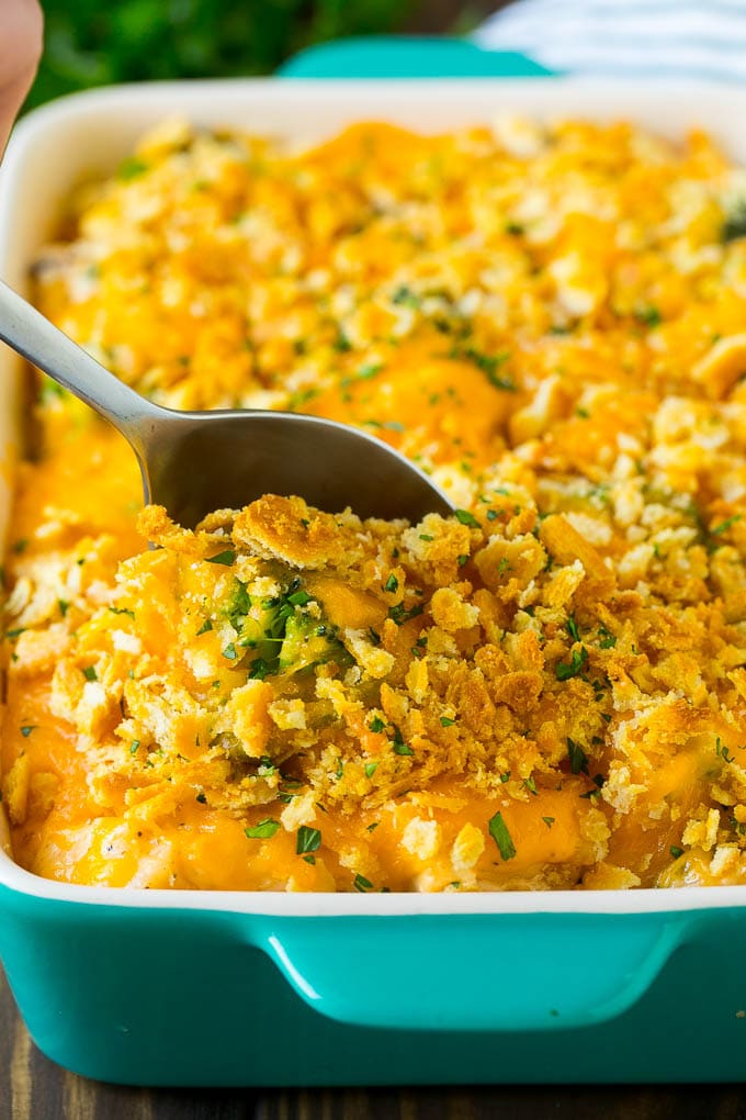 Chicken Casserole Recipe | Chicken and Rice Casserole | Chicken and Broccoli Casserole #casserole #chicken #rice #broccoli #cheese #dinner #edsug A spoon in a dish of chicken and rice casserole.