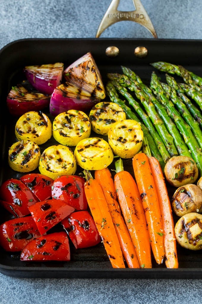 Grilled Vegetables Recipe | Marinated Vegetables | Grilled Veggies #vegetables #veggies #grilling #glutenfree #lowcarb #keto #dinner #edsug #cleaneating #healthy A grill pan with an assortment of vegetables cooking on it.