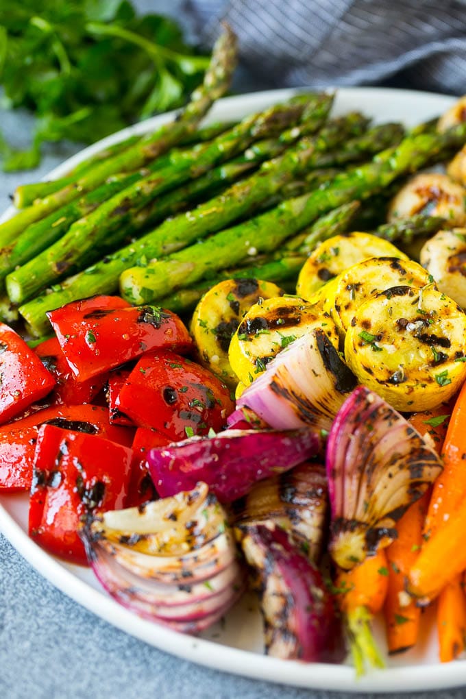 Grilled Vegetables Recipe | Marinated Vegetables | Grilled Veggies #vegetables #veggies #grilling #glutenfree #lowcarb #keto #dinner #edsug #cleaneating #healthy A platter of grilled veggies including peppers, onions and carrots.