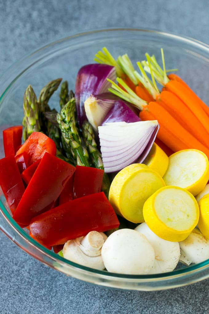Grilled Vegetables Recipe | Marinated Vegetables | Grilled Veggies #vegetables #veggies #grilling #glutenfree #lowcarb #keto #dinner #edsug #cleaneating #healthy Carrots, peppers, squash, mushrooms and asparagus in a mixing bowl.