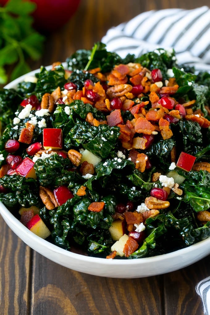 Apple Kale Salad Recipe | Kale Recipe | Fall Salad #kale #apples #bacon #salad #feta #dinner #lunch #edsug Apple kale salad topped with bacon and pecans.