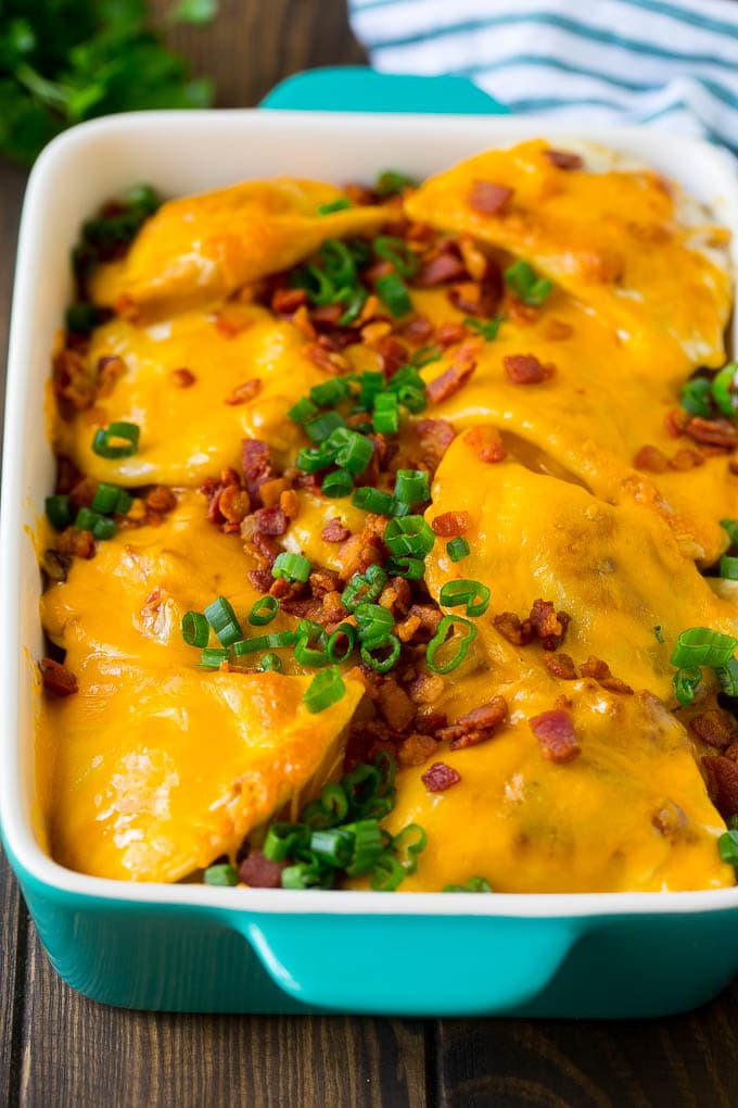 Pierogi Casserole Recipe | Potato Casserole #pierogis #casserole #bacon #cheddar #dinner #edsug A baked pierogi casserole topped with melted cheese, bacon and green onions.