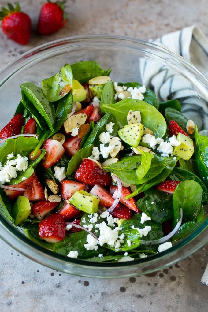 Strawberry Spinach Salad Recipe | Strawberry Salad | Spinach Salad #spinach #salad #strawberries #avocado #edsug A bowl of strawberry spinach salad with feta cheese, almonds and avocado.