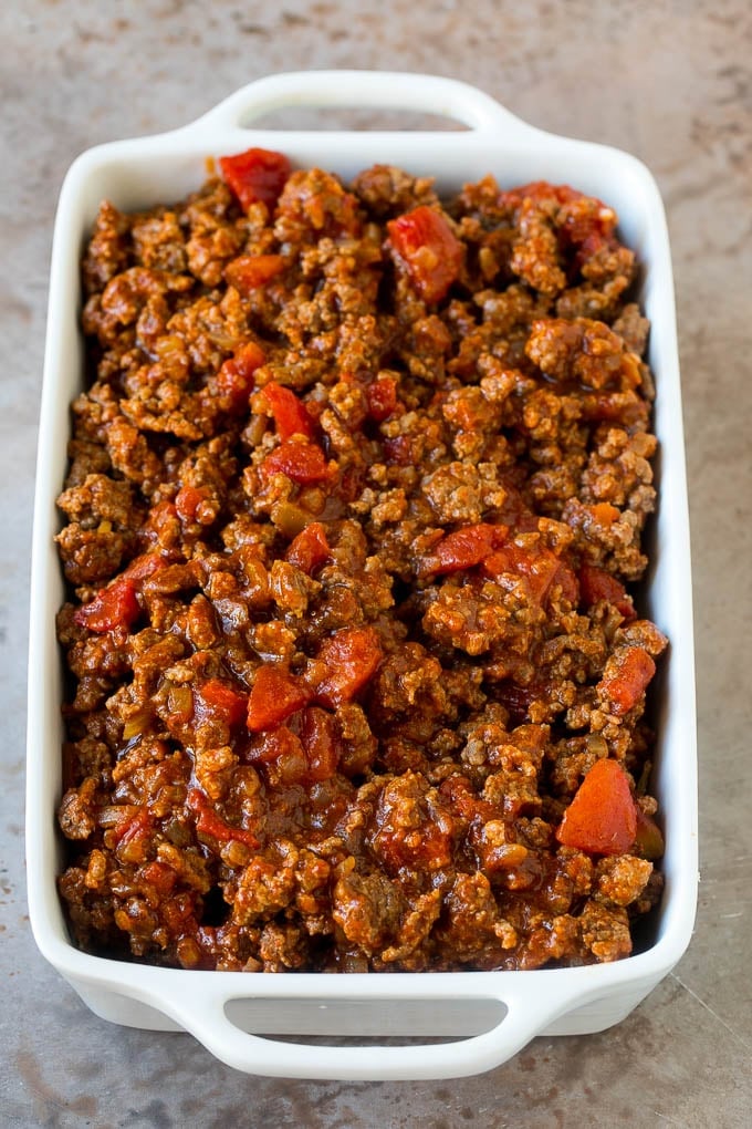 Taco Casserole Recipe | Mexican Casserole | Beef Casserole #casserole #tacos #beef #dinner #cheese #edsug Cooked taco meat in a casserole dish.