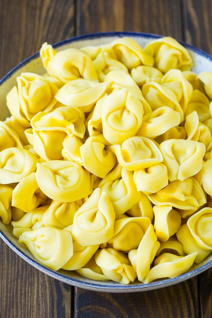 Greek Tortellini Salad Recipe | Pasta Salad | Tortellini Salad | Greek Salad #greek #tortellini #pasta #salad #cucumbers #olives #dinner #edsug A bowl of cooked cheese tortellini.