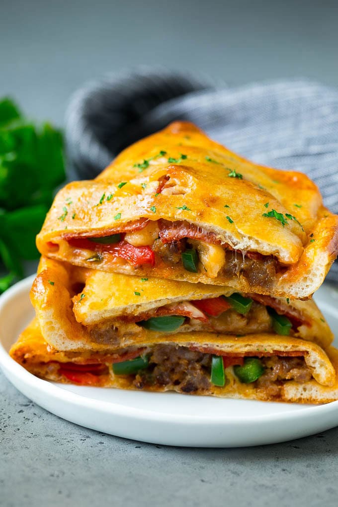 Calzone Recipe | Pizza Pockets #pizza #calzone #pepperoni #sausage #peppers #dinner #edsug #cheese Calzone halves stuffed with sausage, peppers, cheese and pepperoni.