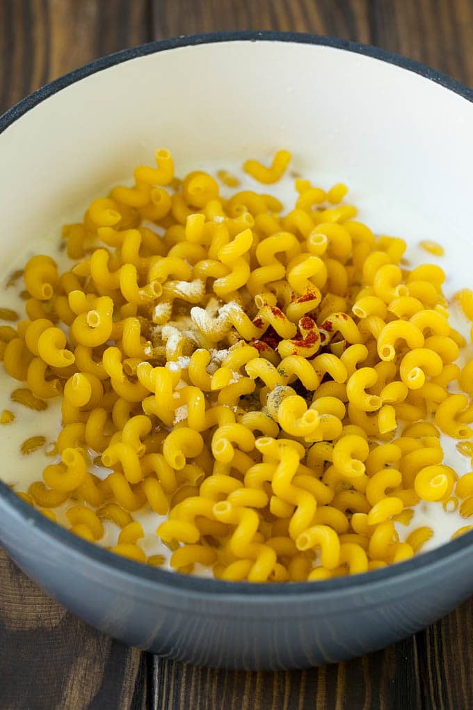 Lobster Mac and Cheese Recipe | Lobster Macaroni and Cheese | Baked Mac and Cheese #pasta #macandcheese #macaroni #lobster #cheese #dinner #edsug Pasta with milk and spices in a pot.