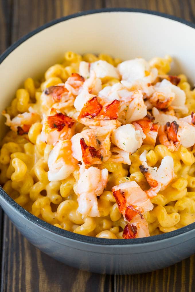Lobster Mac and Cheese Recipe | Lobster Macaroni and Cheese | Baked Mac and Cheese #pasta #macandcheese #macaroni #lobster #cheese #dinner #edsug Stove top mac and cheese topped with pieces of cooked lobster.
