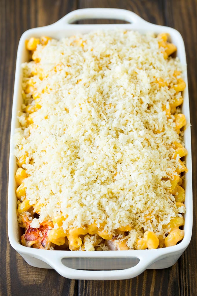 Lobster Mac and Cheese Recipe | Lobster Macaroni and Cheese | Baked Mac and Cheese #pasta #macandcheese #macaroni #lobster #cheese #dinner #edsug A casserole dish of lobster mac and cheese topped with panko breadcrumbs.