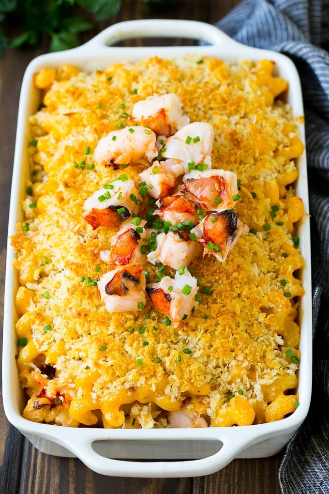Lobster Mac and Cheese Recipe | Lobster Macaroni and Cheese | Baked Mac and Cheese #pasta #macandcheese #macaroni #lobster #cheese #dinner #edsug A baking dish of lobster macaroni and cheese, garnished with chopped lobster meat.