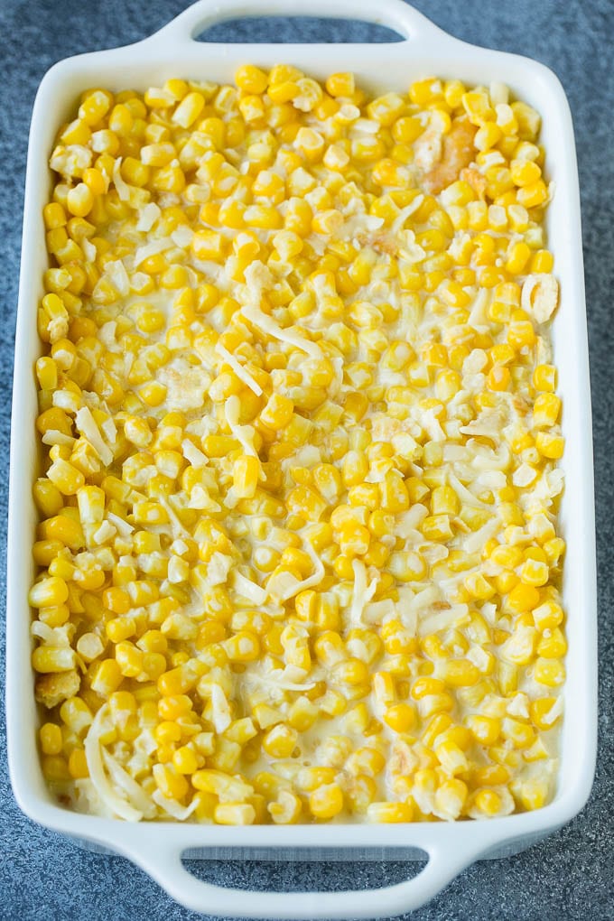 Scalloped Corn | Corn Casserole #corn #casserole #cheese #sidedish #dinner #edsug A baking pan of corn in a creamy custard mixture.