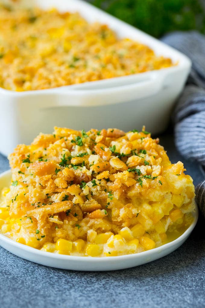 Scalloped Corn | Corn Casserole #corn #casserole #cheese #sidedish #dinner #edsug A serving of scalloped corn topped with buttery cracker crumbs.