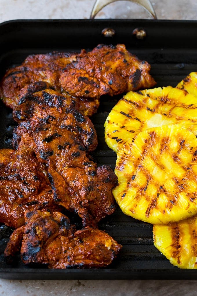 Tacos al Pastor Recipe | Pork Tacos | Mexican Tacos #tacos #pork #pineapple #grilling #tacotuesday #dinner #edsug Grilled pork and pineapple on a pan.