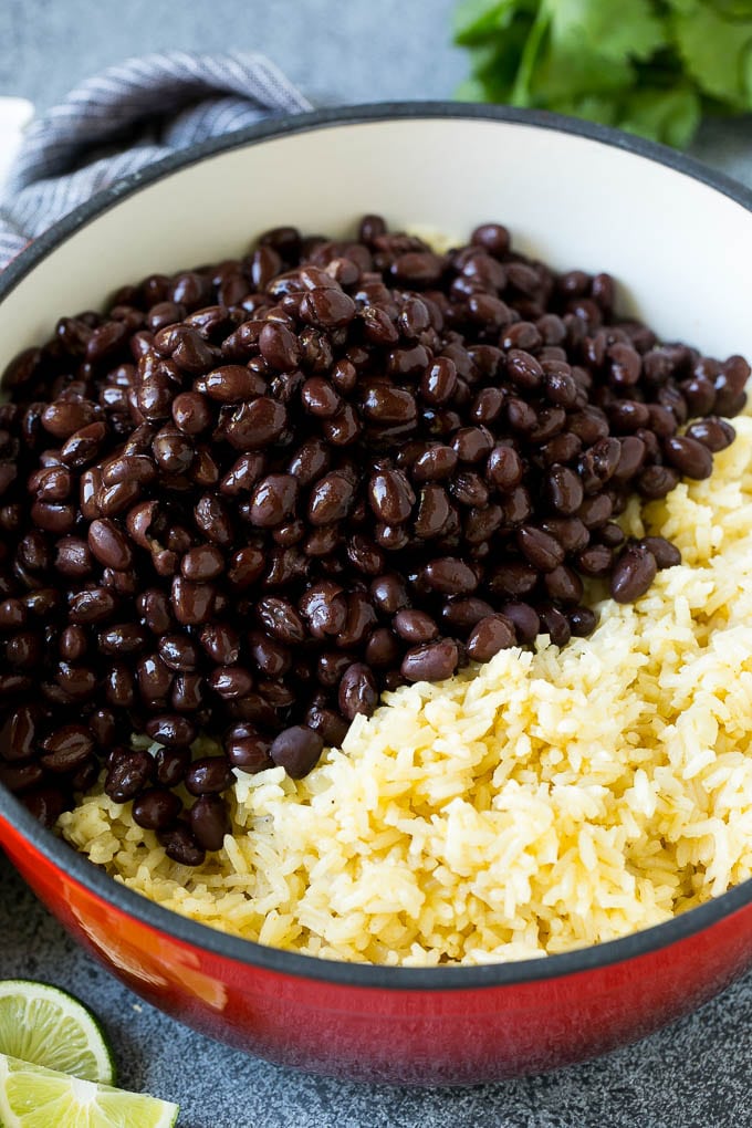 Black Beans and Rice Recipe | Cuban Black Beans | Beans and Rice #beans #rice #blackbeans #sidedish #glutenfree #dinner #edsug Cooked rice and black beans in a pot.