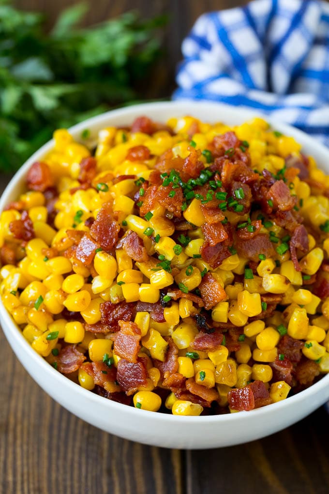 Bacon Fried Corn Recipe | Sauteed Corn | Corn Side Dish #corn #bacon #sidedish #glutenfree #dinner #edsug A serving bowl of Southern fried corn with bacon.