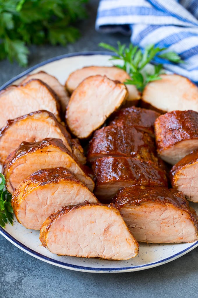 Smoked Pork Tenderloin Recipe | Smoked Pork Loin | BBQ Pork #pork #tenderloin #smoker #dinner #edsug Smoked pork tenderloin sliced on a serving plate.