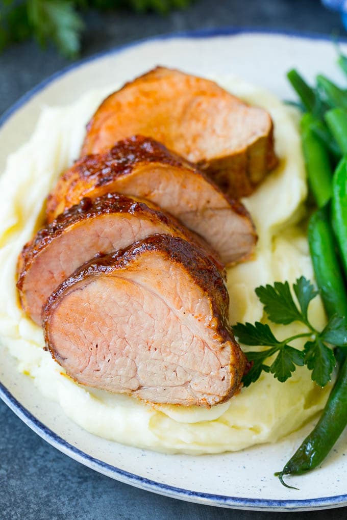 Smoked Pork Tenderloin Recipe | Smoked Pork Loin | BBQ Pork #pork #tenderloin #smoker #dinner #edsug Sliced smoked pork tenderloin served with mashed potatoes and vegetables.