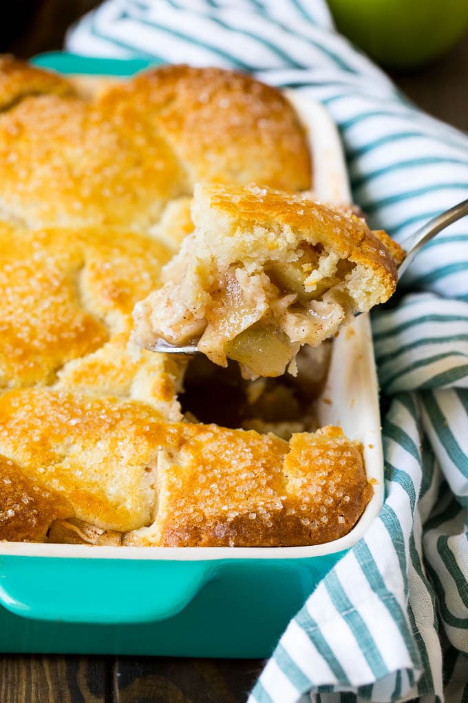 Apple Cobbler Recipe | Apple Dessert #apples #cobbler #dessert #baking #fall #edsug A spoonful of apple cobbler in the serving dish.