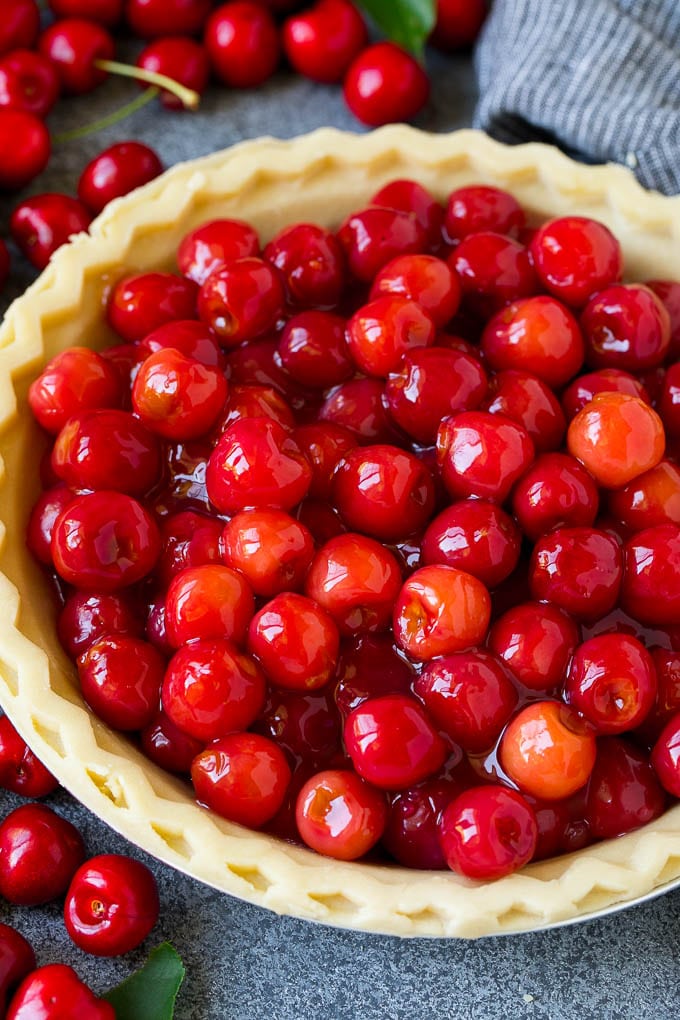 Cherry Pie Filling Recipe #pie #cherries #dessert #sweets #edsug #summer Cherry pie filling inside of an unbaked pie crust.