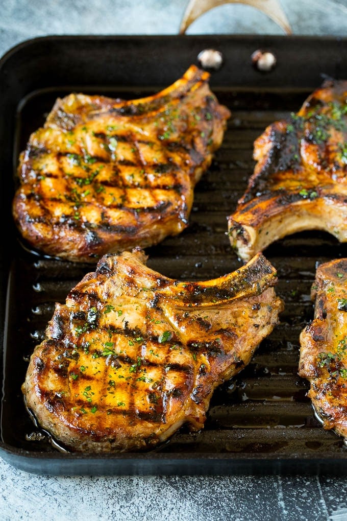 Grilled Pork Chops | Pork Chop Marinade #porkchops #grilling #pork #marinade #dinner #edsug Pork chops on a grill pan.