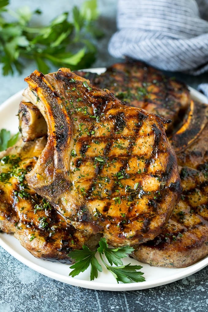 Grilled Pork Chops | Pork Chop Marinade #porkchops #grilling #pork #marinade #dinner #edsug Grilled pork chops coated in marinade then cooked and garnished with parsley.