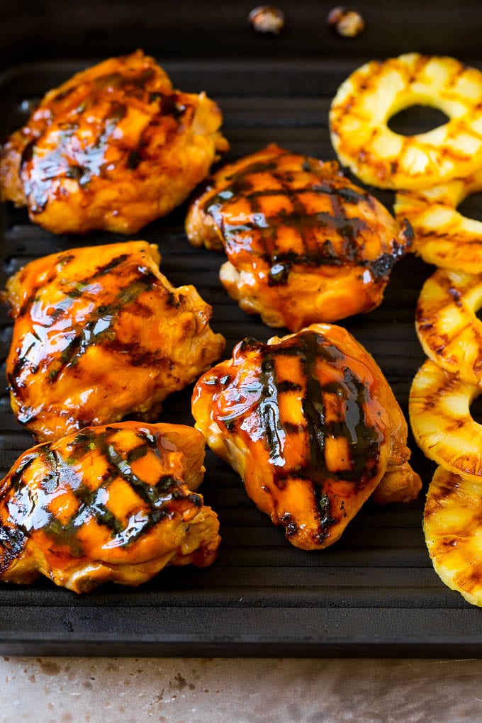 Huli Huli Chicken Recipe | Hawaiian Chicken | Grilled Chicken Thighs #chicken #pineapple #grilling #dinner #edsug Poultry and pineapple slices on a grill pan.