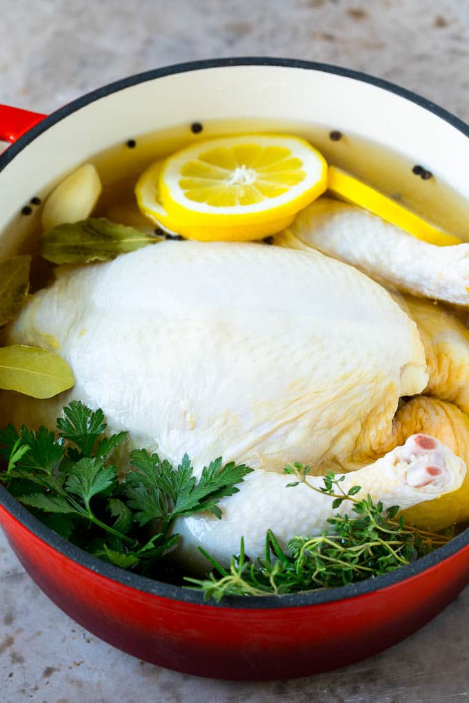 Rotisserie Chicken Recipe | Roasted Chicken #chicken #dinner #edsug #comfortfood A whole chicken in a pot of brine.