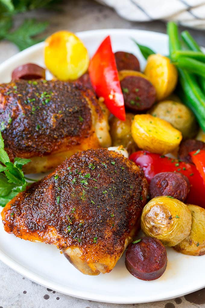 Spanish Chicken Recipe | Sheet Pan Meal | Chicken and Potatoes #spanishfood #chicken #sausage #potatoes #dinner #edsug A plate of Spanish chicken with potatoes, sausage and vegetables.