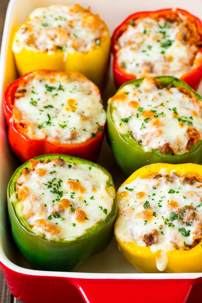 Stuffed Bell Peppers Recipe | Stuffed Peppers #beef #rice #peppers #dinner #cheese #edsug Stuffed bell peppers in a baking dish topped with melted cheese.
