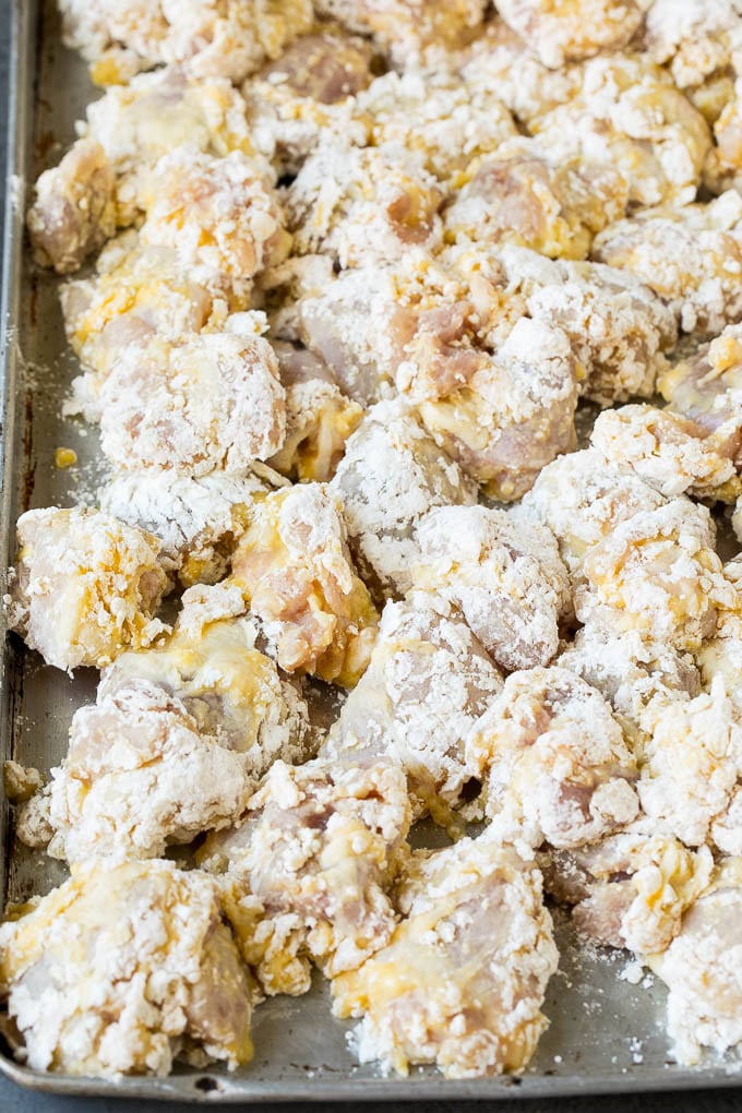 General Tso's Chicken Recipe #chicken #asianfood #dinner #edsug #copycatrecipe Chicken pieces coated in egg, flour and cornstarch.