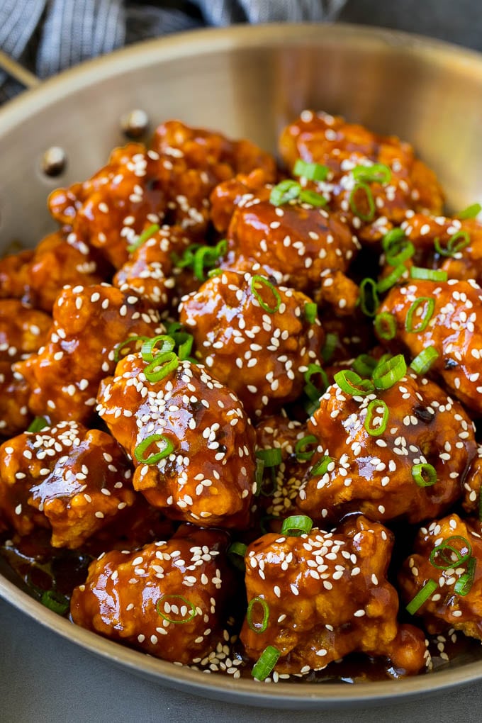 General Tso's Chicken Recipe #chicken #asianfood #dinner #edsug #copycatrecipe General Tso's chicken in a pan coated in a sweet and spicy sauce.