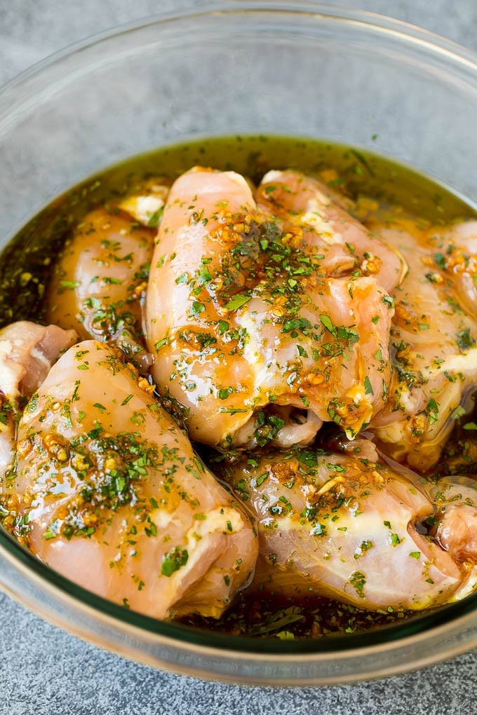 Grilled Chicken Thighs Recipe | Marinated Chicken Thighs #chicken #grilling #marinade #dinner #cilantro #lime #edsug Poultry in a bowl of marinade.