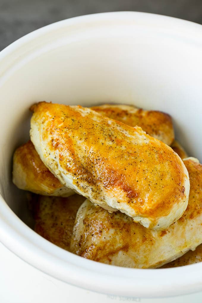 Slow Cooker Chicken Breast Recipe | Crock Pot Chicken Breast | Chicken and Gravy #chicken #slowcooker #crockpot #gravy #dinner #edsug Seared chicken breasts in a crock pot.