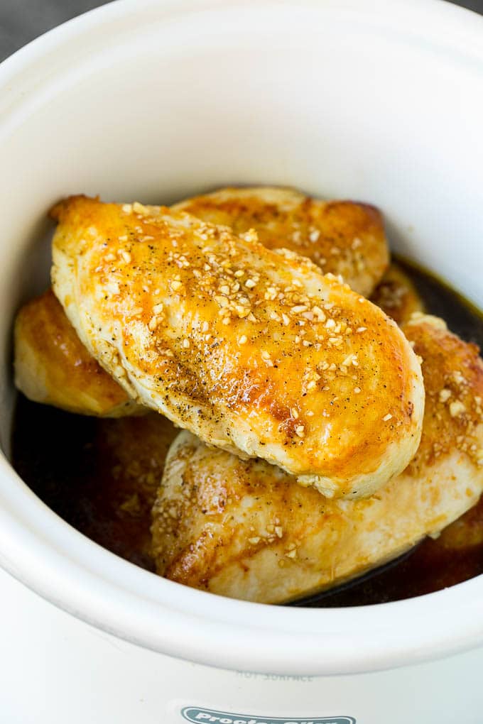 Slow Cooker Chicken Breast Recipe | Crock Pot Chicken Breast | Chicken and Gravy #chicken #slowcooker #crockpot #gravy #dinner #edsug Chicken breasts with garlic and herb sauce poured over the top.