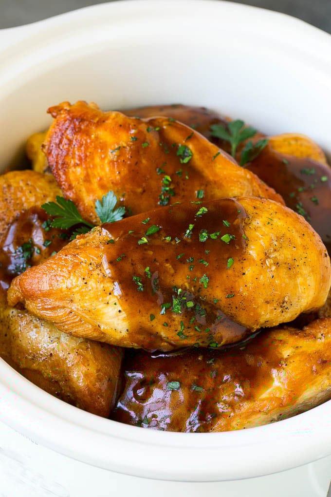Slow Cooker Chicken Breast Recipe | Crock Pot Chicken Breast | Chicken and Gravy #chicken #slowcooker #crockpot #gravy #dinner #edsug Slow cooker chicken breast topped with gravy and parsley.