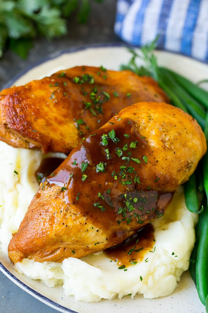 Slow Cooker Chicken Breast Recipe | Crock Pot Chicken Breast | Chicken and Gravy #chicken #slowcooker #crockpot #gravy #dinner #edsug Slow cooker chicken breast served with mashed potatoes and green beans.